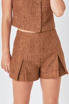 Elevate your wardrobe with our Tweed Pleated Shorts. Made from high-quality tweed fabric, these shorts boast a luxurious feel and timeless appeal. The front pleats add a touch of sophistication while the high rise waistline flatters your silhouette. Designed with a convenient side zipper, these shorts are easy to slip on and off. Perfect for any occasion, from the office to a night out, these shorts will be your new go-to. Don't miss out on this must-have addition to your summer collection. Shop Womens Tweed, Knit Loungewear, Tweed Shorts, Knitwear Trends, Strapless Bodycon Dress, Leather Denim, Tweed Dress, Pleated Shorts, Tweed Fabric