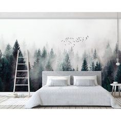 a bedroom with a large mural on the wall and a ladder in front of it