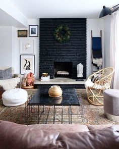 a living room filled with furniture and a fire place