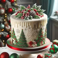 a decorated christmas cake sitting on top of a table