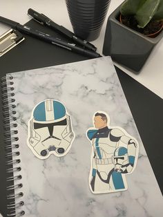 the star wars stickers are next to a notebook