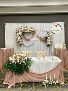 the table is set up with flowers and candles for an elegant wedding reception or celebration