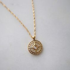 "Finding your path is a personal journey, a dance between self-discovery and the whispers of your heart, leading you to the destination only meant for you." Find your way in style with our Compass Necklace. This playful pendant necklace features a sparkling cubic zirconia center. The perfect accessory for any adventure, it adds a touch of whimsy to any outfit.    -16" in length with 2" extender -stainless steel, gold plated Elegant Charm Necklace With Compass Design, Finding Your Path, The Whispers, Compass Necklace, Find Your Way, Personal Journey, Casual Style Outfits, Style Outfits, Self Discovery