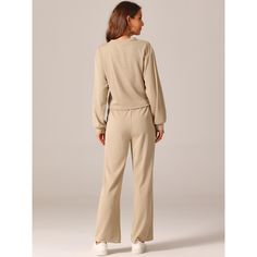 Fashion Style: Long Sleeve Crop Tops/Round Neck/Solid Color/Ribbed Knit/Wide Leg Pant/Tracksuit Lounge Sets. Perfect for both day and evening occasions, these blouses add a touch of elegance and style to any wardrobe. The twist front long sleeve top looks stylish and can be worn separately from the wide leg sweatpants. This lounge tracksuit is ideal for casual street looks, leisure at home, workouts, running, weekends, vacations, and beach outings. Made of 95% Polyester and 5% Spandex, it offers Beige Long Sleeve Set For Fall, Solid Color Matching Set For Fall, Long Sleeve Pant Set In Solid Color, Solid Long Sleeve Pant Set, Solid Color Long Sleeve Matching Pant Set, Long Sleeve Lounging Sets For Fall, Solid Crew Neck Sets For Loungewear, Relaxed Fit Lounge Pant Set, Solid Color Relaxed Fit Pant Set For Loungewear