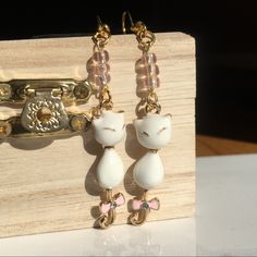 Beautiful Siamese Cat Drop Earrings With Translucent Pink Glass Beads Measures 2” Long . Comes With Both Gold & Rubber Backings . Handmade In Los Angeles , Ca Adjustable White Jewelry With Cat Design, Adjustable White Cat Design Jewelry, White Cat Design Earrings For Gift, White Cat Design Earrings As A Gift, White Cat Design Earrings As Gift, Elegant White Jewelry With Cat Design, Elegant White Cat Design Jewelry, Cute White Cat Ears Jewelry, White Cat Design Jewelry With Cat Ears