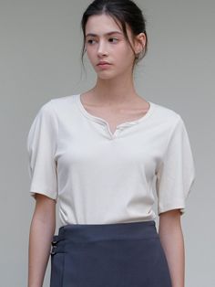 This is a minimal and feminine top by ourcomos that is made out of high quality and sturdy material. With distinctive mood of the design and comfortable wear, you can use it for your daily lifestyle.- Pin tuck shirring on the waist- Pleat detail on the sleeve- Feminine heart neckline Simple Beige Top For Everyday, Versatile Everyday Beige Tops, Simple Everyday Beige Top, Versatile Solid Tops For Casual Gatherings, Versatile Tops For Casual Gatherings, Versatile Solid Color Tops For Casual Gatherings, Versatile Beige Cotton Tops, Simple Short Sleeve Tops For Workwear, Simple Short Sleeve Tops For Work