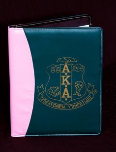 a blue and pink folder with the letters aka on it