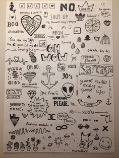 an art piece with many different types of doodles on the paper, including letters and numbers