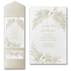 an elegant wedding card with white flowers and greenery