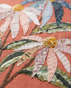 the fabric has been stitched together with flowers