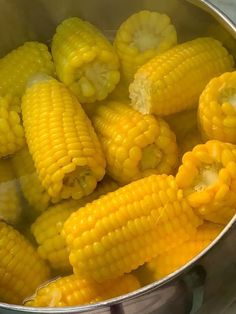 corn is cooked in a pot on the stove and ready to be steamed for cooking