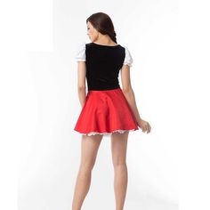 a woman wearing a red skirt and black top with white lace trims on the bottom