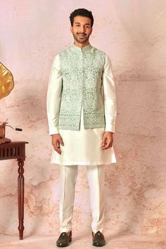 Mint green bundi with vintage jaal pattern, contrast dori and lurex badla embroidery. Paired with cream full sleeve kurta and pant style pyjama. - Aza Fashions Cream Embroidered Nehru Jacket With Traditional Drape, Festive Pista Green Embroidered Nehru Jacket, Traditional Raw Silk Nehru Jacket Semi-stitched, Luxury Green Embroidered Nehru Jacket, White Embroidered Semi-stitched Nehru Jacket, Fashion App, Embroidered Silk, Raw Silk, Full Sleeve