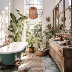 a bathroom with a tub, mirror and plants in it