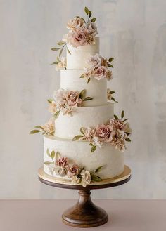 a three tiered cake with flowers on it