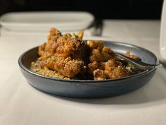 a bowl filled with food sitting on top of a table