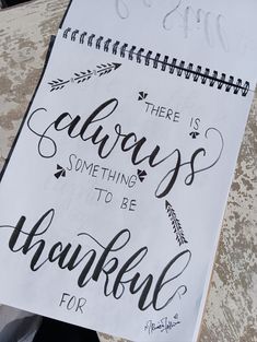 there is always something to be grateful for written on a spiral notebook with black ink