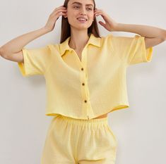 Unveil a fresh, contemporary look with our Muslin Shirt featuring Short Sleeves. Exquisitely crafted from crinkle cotton, this Crop Blouse for women offers a relaxed yet chic appearance, making it a must-have for every fashion-forward wardrobe. The gauzy texture accentuates its breezy nature, ensuring maximum comfort during those warm days. This Gauze Loose Top, with its delicate button details and flattering cut, is perfect for pairing with jeans, skirts, or shorts.  * Made from European muslin (100% cotton) * OEKO-TEX certified fabric (no harmful chemicals used in production) * From XS to Plus size TAKING CARE: * machine wash gentle (30- 40 C/ 104 F) * dry gentle. * do not bleach. Each order is sewn with love and attention to detail especially for you. Summer Cotton Shirt With Crinkle Texture, Summer Tops With Crinkle Texture For Daywear, Chic Cotton Tops With Crinkle Texture, Summer Crinkle Texture Top For Daywear, Spring Linen Tops With Crinkle Texture, Linen Blouse With Crinkle Texture, Summer Crinkle Texture Short Sleeve Blouse, Spring Cotton Top With Crinkle Texture, Spring Cotton Crinkle Texture Top