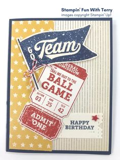 a birthday card with the words team on it and some tags hanging from it's side