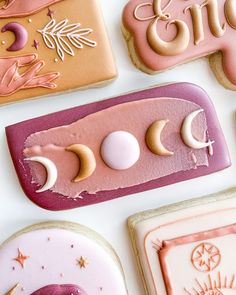 decorated cookies with moon, crescent and stars on white table top next to each other