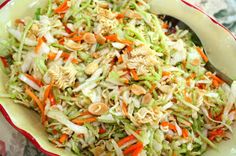 a bowl filled with coleslaw and carrots