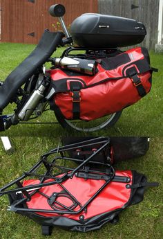 a red bag sitting on the back of a motorcycle