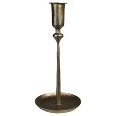 a metal candle holder on a white background