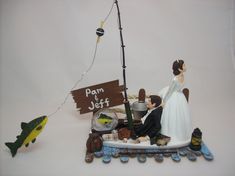 a figurine of a bride and groom fishing