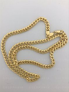 "14K Yellow Gold Miami Cuban Link Chain Necklace, 20\" 22\" Inch, 4.5MM Thick, Real Gold Cuban, Hollow Cuban Chain, Cuba Gold Chain, Men Women Metal: 14K Yellow Gold Closure: Lobster Claw Availability: 4.5 MM - 20\" - 12.3 Gram 4.5 MM - 22\" - 13 Gram SHIPPED FROM NEW YORK CITY FREE SHIPPING on all orders 30 Day Return Hassle Free Weight is approximate and may not always be exactly as stated. At GoldMania we are first of all committed to environmental responsibility. We guarantee that the silver Yellow Gold Polished Cuban Link Necklace, Yellow Gold Cuban Link Necklace With Polished Finish, 14k Gold Cuban Link Necklace With Polished Finish, Gold Cuban Link Necklace Hallmarked, Gold Chain Men, Thick Gold Chain, Real Gold Chains, Miami Cuban Link Chain, Miami Cuban Link