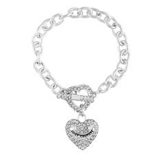 PRICES MAY VARY. Glamorous and chic, this Juicy Couture bracelet features sparkling glass stones and a heart charm for a touch of romance. The toggle closure ensures a secure and comfortable fit, while the silvertone finish adds a touch of sophistication to any outfit. Perfect for a night out or a special occasion, this bracelet is a must-have addition to your jewelry collection. Length: 7.5" Juicy Couture Bracelet, Fragrance Set, Toggle Bracelet, Silver Bracelets, Heart Charm, Juicy Couture, Chain Bracelet, Heart Pendant, Jewelry Sales