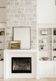 a living room filled with furniture and a fire place