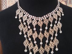 ON SALE Very nice statement bib rhinestone necklace in excellent vintage condition. Measures 18 in Long and the big portion is 7 in wide by 9 in Long. Very classy addition to any vintage jewelry collection. Perfect for a vintage wedding. Vintage Bling Jewelry For Party, Jeweled Costume Jewelry Necklaces For Evening, Vintage Rhinestone Party Necklace, Costume Jewelry Necklace With Bling, Vintage Metal Jewelry With Bling, Vintage Rhinestone Necklaces For Evening, Vintage Jeweled Necklaces For Wedding, Vintage Rhinestone Evening Necklaces, Vintage Rhinestone Bridal Necklace For Party