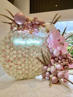 balloons and flowers are arranged on the floor