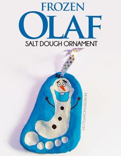 an ornament with a snowman hanging from it's side on a cell phone