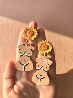 Celebrate body positivity and feminism with these woman figural earrings. Each pair features a different body type, highlighting that all women are uniquely beautiful, as each different flower is uniquely beautiful. Made of polymer clay and very lightweight, with a speckled granite appearance and intricate painted details. Statement earrings. | Woman Body Earrings, Woman Figure Earrings, Womens Bust Sculpture Earrings, Feminist Earrings, Feminism Body Positivity Plus Size Body Earrings, Unique Handmade Earrings, Bust Sculpture, Polymer Earrings, Feminist Gift, Women Figure, Different Flowers, Body Positivity, Polymer Clay Earrings