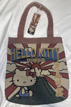 This rare Loungefly Sanrio Hello Kitty tote bag is a must-have for any Hello Kitty fan! Featuring beautifully embroidered accents and made of durable canvas, this bag is not only stylish but also practical for everyday use. With its multicolor exterior and Sanrio product line, it's the perfect addition to any collection. Designed for women and brand new with tags, this Loungefly Sanrio Hello Kitty tote bag is a statement piece that will surely turn heads. Please see pictures for exact items you Hello Kitty Tote Bag, Hello Kitty Canvas, Hello Kitty Tote, Hello Kitty Bag, Cute Purse, Painted Tote, Loungefly Bag, Thrift Finds, Embroidered Bag