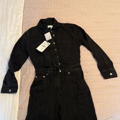 Nwt Zara The Dorian Long Denim Black Jumpsuit Zara New With Tag Never Worn! Size: Small Color: Black Long Lapel Collar Jumpsuit Long Cuffed Sleeves Patch Pockets At Chest, Sides, And Back Washed Effect Front Metal Button Closure Black Denim Jumpsuit With Button Closure, Black Long Sleeve Jumpsuit With Button Closure, Black Relaxed Fit Denim Jumpsuit For Work, Black Jumpsuits And Rompers With Button Closure For Spring, Spring Black High Waist Denim Jumpsuit, Spring High Waist Black Denim Jumpsuit, Spring Black High-waist Denim Jumpsuit, Spring High-waist Black Denim Jumpsuit, Fitted Long Sleeve Denim Jumpsuit For Work