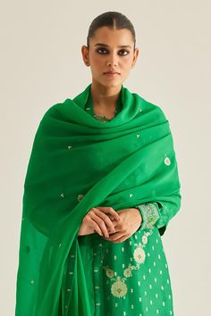 Emerald green brocade kurta with all over varied floral woven pattern and zardozi embroidered yoke. Paired with brocade trousers and organza embroidered dupatta.
Components: 3
Pattern: Woven and Embroidered
Type Of Work: Floral Pattern and Zardozi Work
Neckline: Round Neck
Sleeve Type: Full Sleeves
Fabric: Brocade, Organza, Georgette
Color: Emerald Green
Other Details: 
Attached lining
Potli and contrast border
Side slits
Embroidered sleeve borders
Length:
Kurta: 48 inches
Trouser: 38 inches
Kur Festive Green Chikankari Embroidery Blouse Piece, Green Blouse With Chikankari Embroidery For Transitional Season, Festive Green Blouse With Chikankari Embroidery, Green Blouse Piece For Wedding And Transitional Season, Green Georgette Straight Kurta, Elegant Green Chikankari Embroidery Blouse, Elegant Green Blouse With Chikankari Embroidery, Green Silk Traditional Wear For Wedding, Green Silk Sharara With Traditional Drape