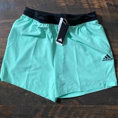 Elevate Your Gym Wardrobe With These Adidas Axis Woven 6 Inch Training Shorts In Size L. The Easy Green Color And Solid Pattern Make Them A Versatile Addition To Your Activewear Collection. The Drawstring Closure Ensures A Comfortable Fit, While The Elastic Waist And Quick-Dry, Moisture-Wicking, And Breathable Features Keep You Cool During Your Workouts. The Knit Fabric Is 100% Polyester And Machine Washable For Easy Care. The Shorts Have Pockets For Storing Your Essentials While You Train. Suit Adidas Green Workout Activewear, Green Adidas Workout Activewear, Adidas Running Shorts For Summer, Adidas Green Sportswear Bottoms, Adidas Green Sports Shorts, Adidas Green Sporty Shorts, Adidas Sporty Green Shorts, Sporty Green Adidas Shorts, Casual Green Adidas Shorts