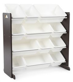 a wooden shelf with white bins on it