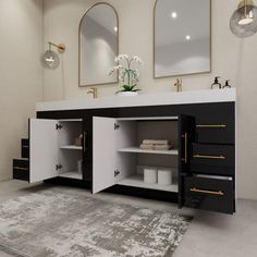 a white and black bathroom with two mirrors on the wall next to a rug in front of it