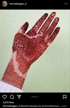 a woman's hand with henna on it