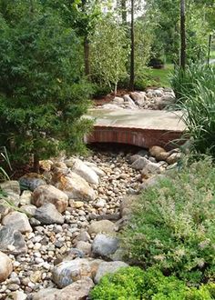 there is a small bridge over some rocks