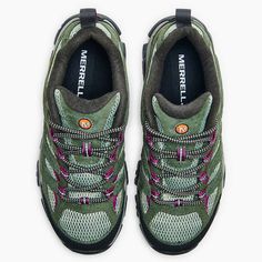 a pair of green and pink shoes on a white background with the words merrell written in black