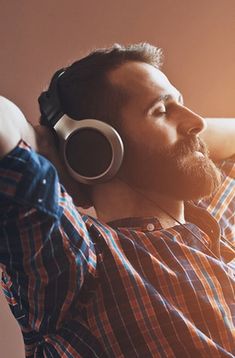 a man with headphones laying on his back