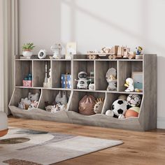 a bookcase filled with lots of stuffed animals and other things on top of it