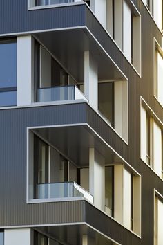 an apartment building with multiple balconies and windows