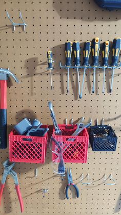 there are many tools hanging on the pegboard