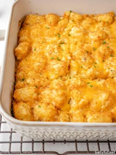 a casserole dish with cheese and parsley