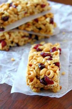 three granola bars sitting on top of a piece of paper next to each other